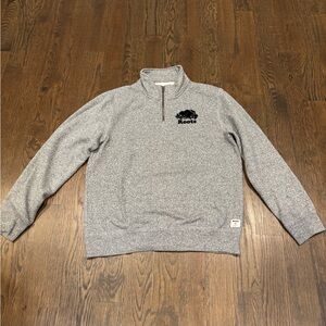 Roots sweatshirt. Black/grey. Small blue spot on left sleeve